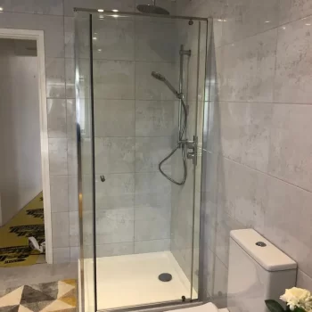 Glassglass shower cubicle with toilet by Bathroom Inspirations Dorchester