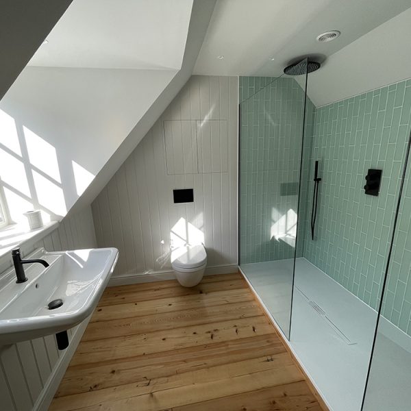 wooden floor bathroom with glass shower
