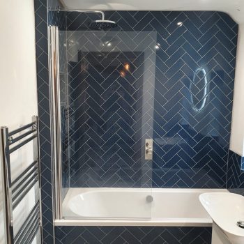 Blue tiled bathroom and shower