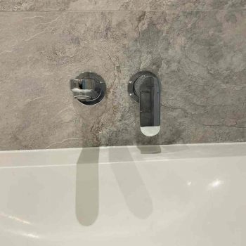 Bath Taps on Grey Marble by Bathroom Inspirations