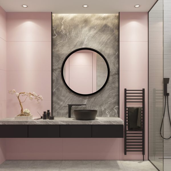 Luxury light pink and bold black bathroom with large wall tiles and natural gray stone block